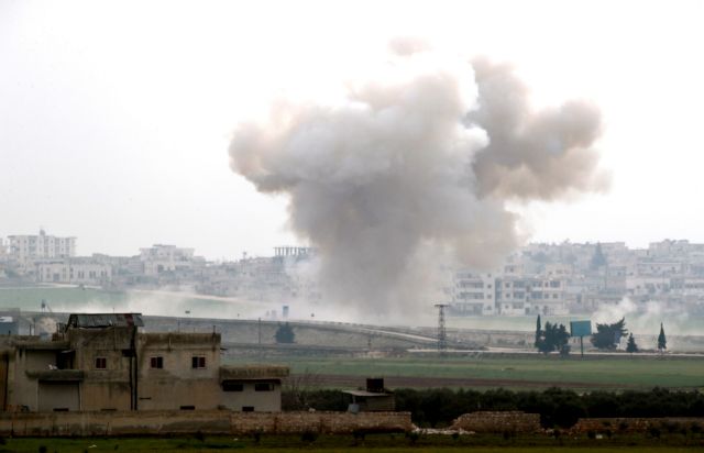 Smoke rises after an air strike in Saraqeb in Idlib province